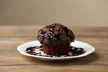 Yummy chocolate cupcake on table