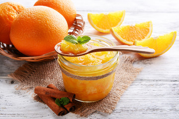 Delicious orange jam on table close-up