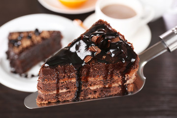 Yummy chocolate cake served on table, close-up