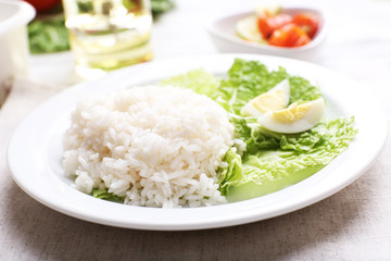 Boiled rice served on table, close-up
