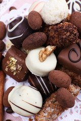 Heap of sweet chocolates with coffee beans