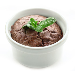 Hot chocolate pudding with fondant centre isolated on white