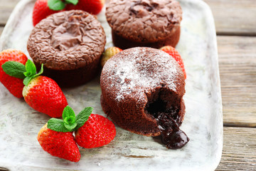 Hot chocolate pudding with fondant centre with strawberries,