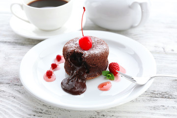Hot chocolate pudding with fondant centre on plate, close-up