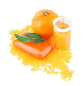 Bottle of bath salt with fresh orange and bar of soap isolated