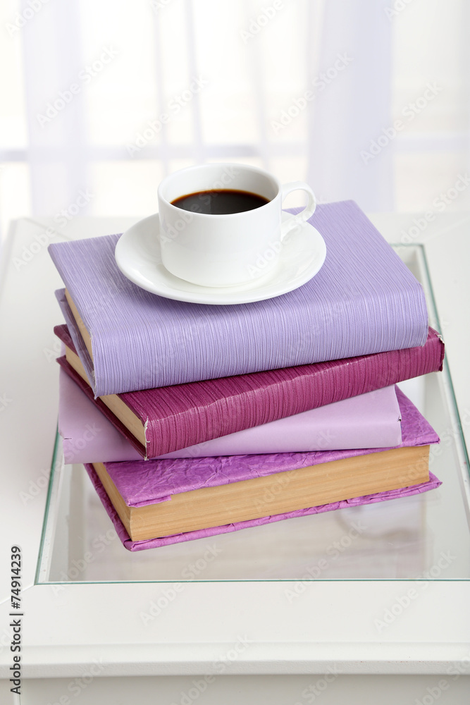 Sticker Purple books with cup near sofa