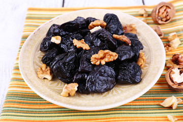 Plate of prunes and walnut