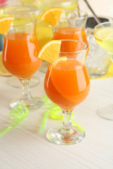 Glasses of fruit cocktails in party close-up