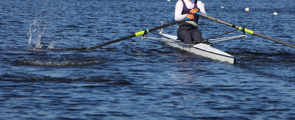 Athlete rower at the start. spray.