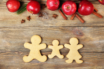 Christmas cookies and fruits on wooden table