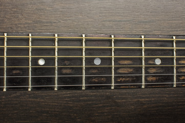 Acoustic guitar frets close up