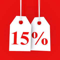 15 percent off - hanging labels on red background