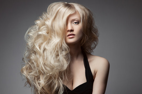 Beautiful Blond Woman. Curly Long Hair