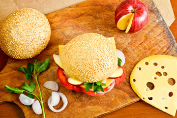 Delicious burger with fruits and vegetables