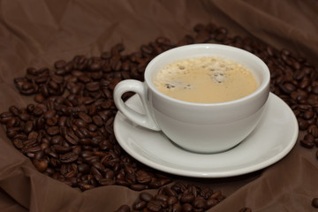Coffee cup and beans. Selective focus.
