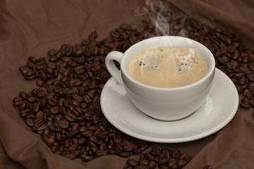 Coffee cup and beans. Selective focus.