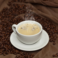 Coffee cup and beans. Selective focus.