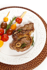 Lamb Chops with cherry tomato. Selective focus.