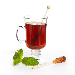 Tea with Mint Leaf and Candy Brown Sugar on a Sticks