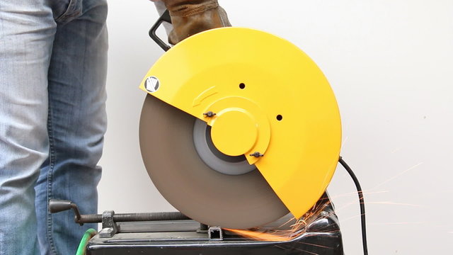 Machine cutting a metal object.