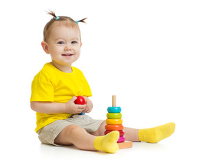 happy baby playing with colorful wood pyramid isolated