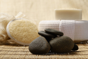 Fototapeta na wymiar zen stones and spa set on the wood for treatments