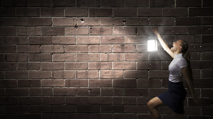 Businesswoman with lantern