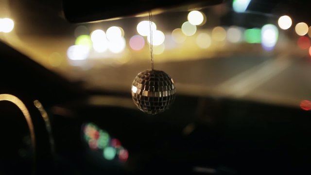 Disco ball hanging in the car