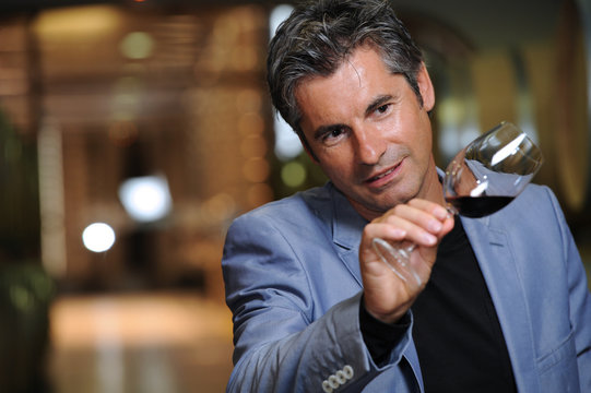 Tourism - Man tasting wine in a cellar-Winemaker
