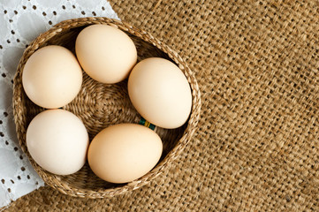 fresh organic eggs on  burlap background