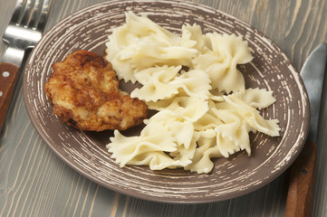 Chicken meat with pasta farfalle