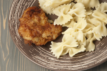 Chicken meat with pasta farfalle