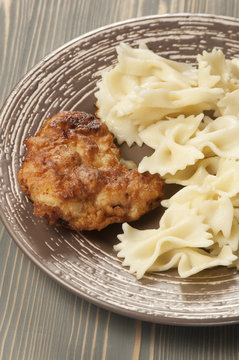 Chicken meat with pasta farfalle