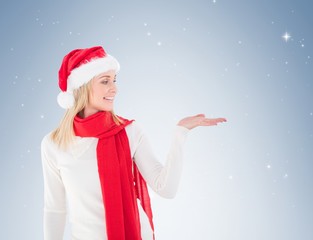 Festive blonde holding hand out