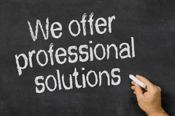 Blackboard with the text We offer professional solutions