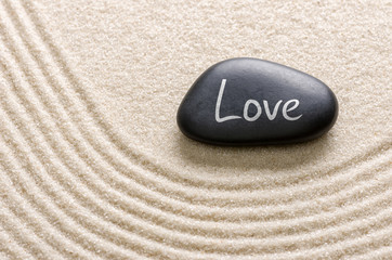 Black stone with the inscription Love
