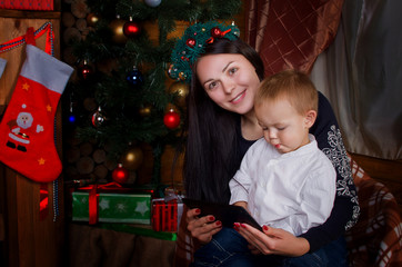 Fototapeta na wymiar Mom and son holding a tablet PC