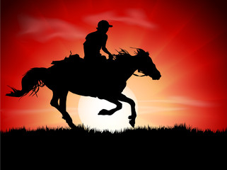 Silhouette of the equestrian of the jockey riding on sunrise