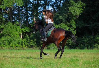 Young rider is carried away on a horse