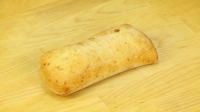 Сiabatta rotates on a wooden boards background