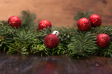 Red christmas baubles on the snow. christmas decorations