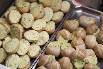 full and half snails with parsley and garlic butter