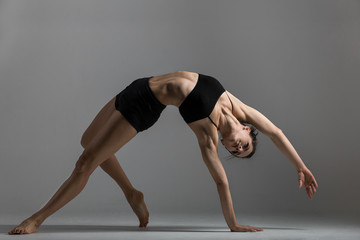 Gymnast girl performs exercise