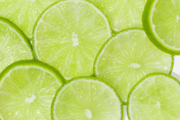 Natural green lime slices background