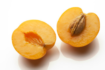 juicy apricots sliced isolated on white background