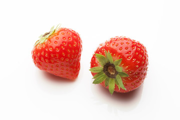 two strawberrys on white