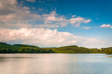 Evening clouds over hills and Lake Williams, in York, Pennsylvan