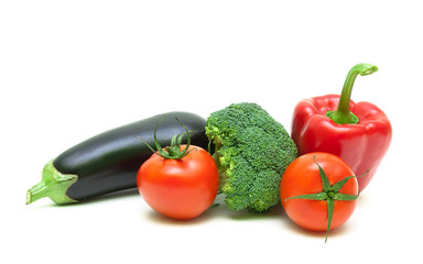 broccoli, eggplant, cherry tomatoes and red pepper on white back