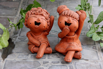 Smiling ceramic kids