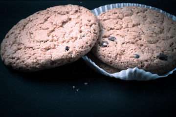 Oat cookies on the old shabby background. tinted